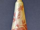 a small glass vase sitting on a table
