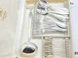 an open box with a set of silverware in it