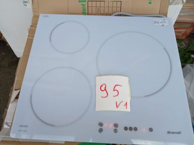 a cardboard box that has a stove top and a box with a sticker on it
