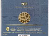 the back cover of a blue book with a gold medal on it