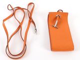 an orange cell phone case with a lanyard attached to it