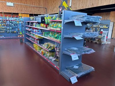 many shelves in the store that have various items on them