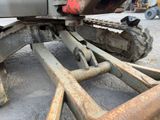 a close up of a tractor with a chain attached to it
