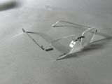 a pair of glasses sitting on top of a table