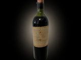 a bottle of wine on a black background