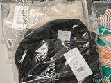 many items that are wrapped in plastic bags on the table