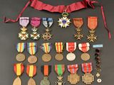 an assortment of medals and medals are displayed on a table
