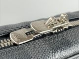 a close up of a zipper on a black purse