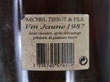 a label on a bottle of wine on a table