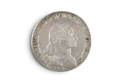 an old silver coin on a white surface with a white background