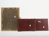 three old books sitting next to each other on a table
