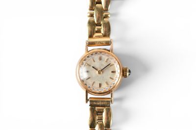an image of a woman ' s wrist watch on a white background