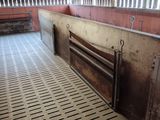an image of a horse barn with a lot of stalls