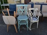 many different colored chairs and chairs in a parking lot
