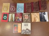 many books that are sitting on a table