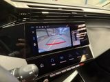 the dashboard of a car with a camera mounted to it ' s screen