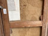 a picture of an old wooden cabinet with a glass door
