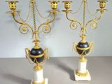 pair of antique brass and marble candelabs with black and white vases