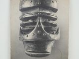 an old photo of a poster with a helmet on top of it