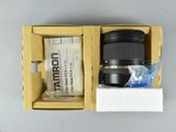 a box with a camera and a lens inside of it