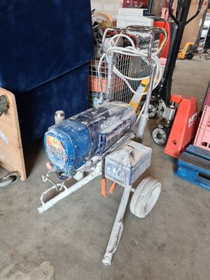 a small machine that is sitting in a garage