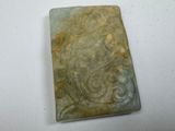 an image of a piece of green marble on a white surface