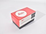 a red and white box with a logo on it