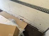 a box that is sitting on the floor in front of a door