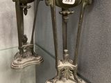 two vases that are on display in a glass case