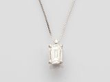 an emerald - cut diamond pendant on a chain