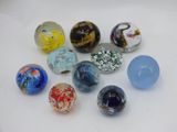 a lot of glass beads that are on a table