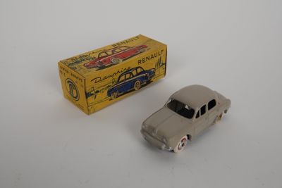 a small toy car sitting next to a box on a table