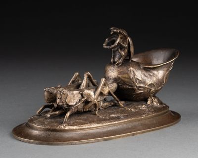 sculpture en bronze représentant un cheval et un chien dans un traîneau