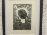 drawing of a woman ' s profile in a black frame against a white wall