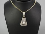 an art deco diamond pendant on a gold chain on a mannequin
