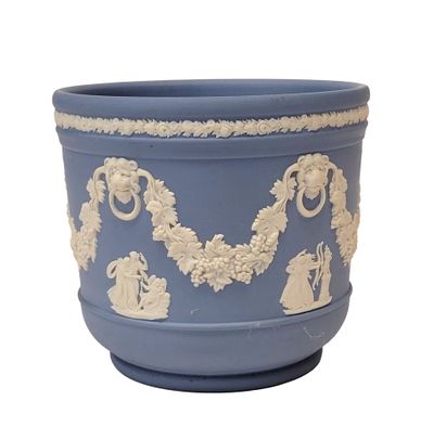 a blue pot with a white design on it
