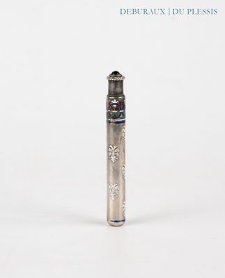 a silver pen that is sitting on a white surface