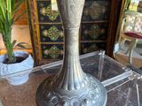 a vase that is sitting on a table in a room