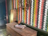 a wooden table with a phone on it in a room