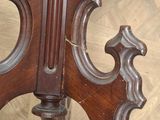 a close up of a wooden table with a clock on top of it