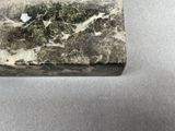 a marble box that has a piece of paper on top of it