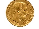 l'image d'une pièce d'or sur laquelle figure le visage d'un homme