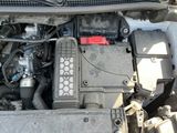 a picture of a car engine with its hood open