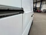 a white van that is parked in a garage