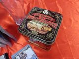 a small tin box with a picture of a train on it