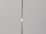 an antique silver plated candle holder on a clear glass stand