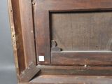 a picture of an old wooden frame with a picture in it