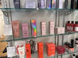 many different types of hair products displayed on the shelves
