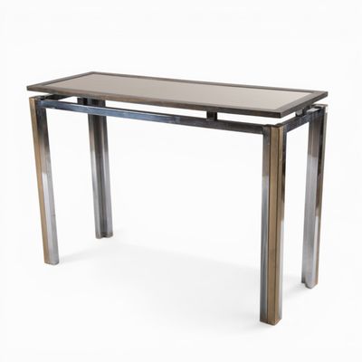 an image of a table with a glass top and metal legs