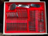 a box with a bunch of forks and spoons in it